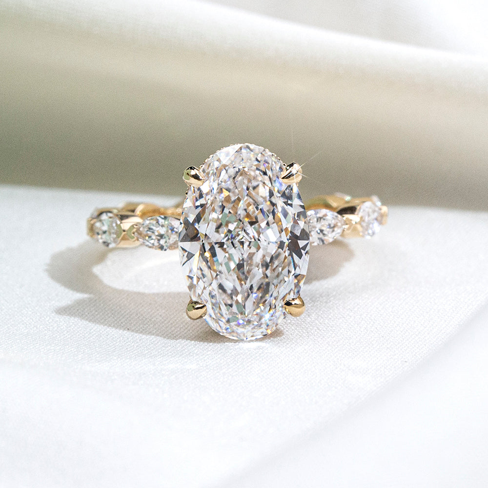 Eco-1904: Crowned Grace – Lab-Grown Oval Diamond Halo Ring with Marquise Band in 18K Yellow Gold