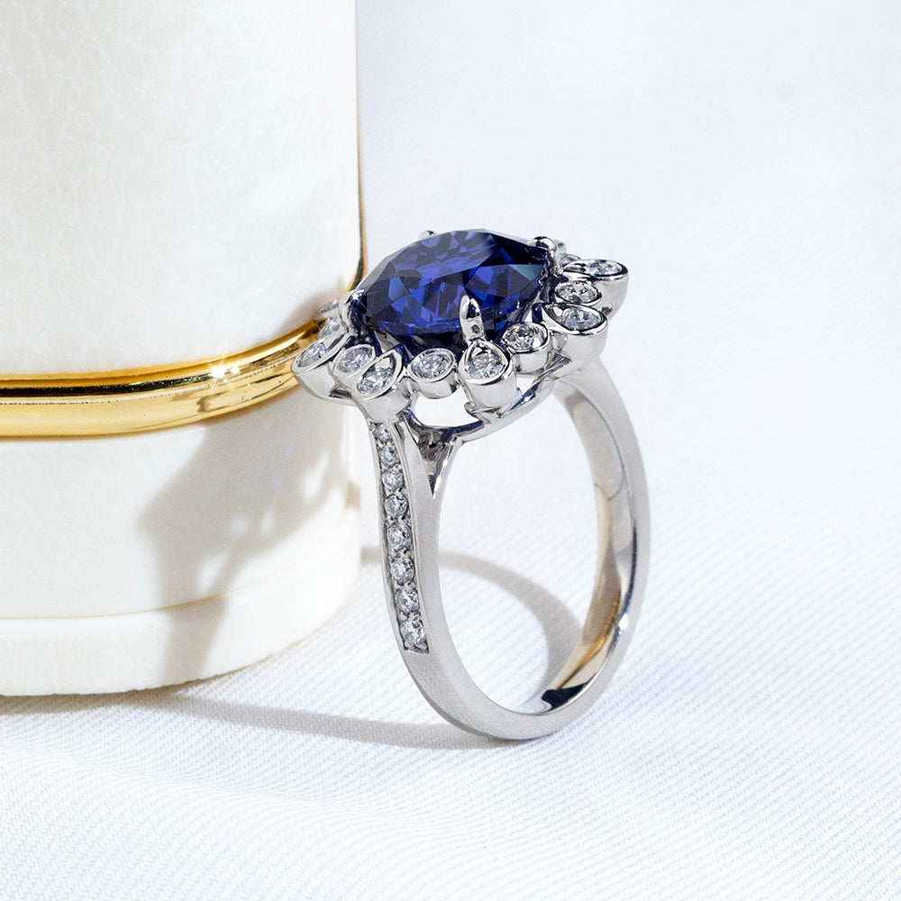Eco-1905: Midnight Bloom – Lab-Grown Blue Sapphire & Diamond Halo Ring in 18K White Gold