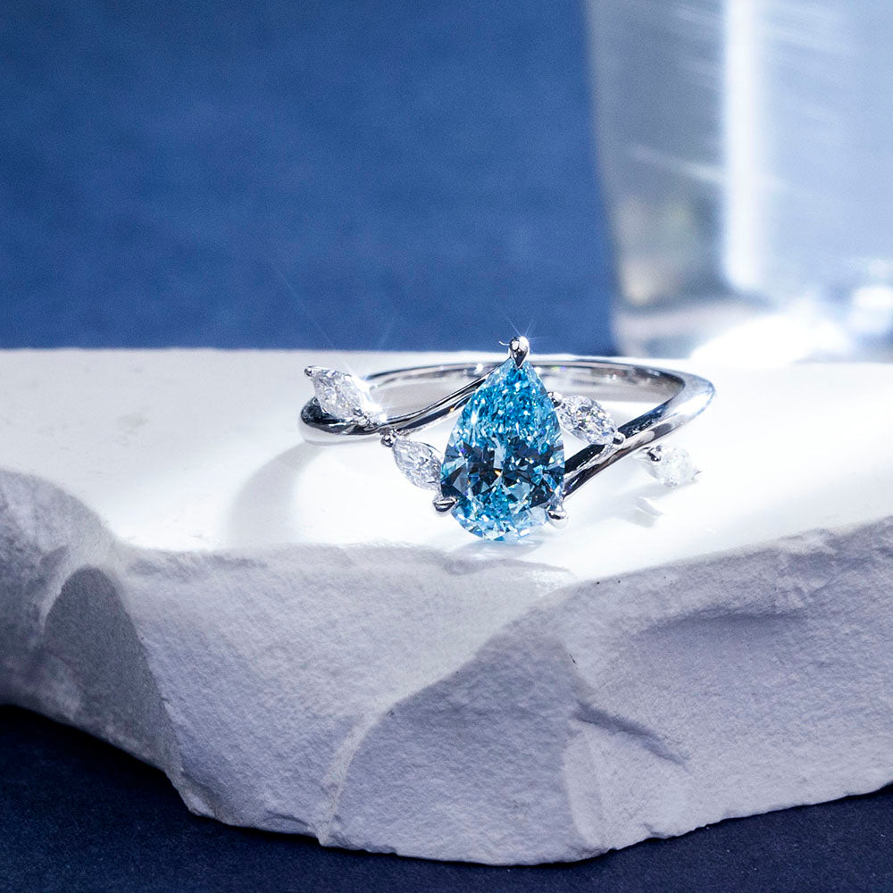 Eco-1860: Skyborn Grace – Lab-Grown Blue Diamond Leaf Ring in 18K White Gold