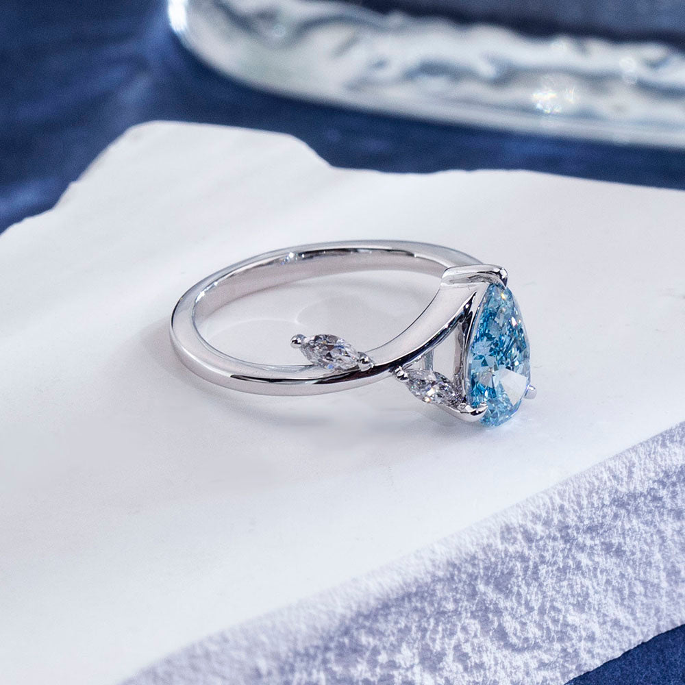 Eco-1860: Skyborn Grace – Lab-Grown Blue Diamond Leaf Ring in 18K White Gold
