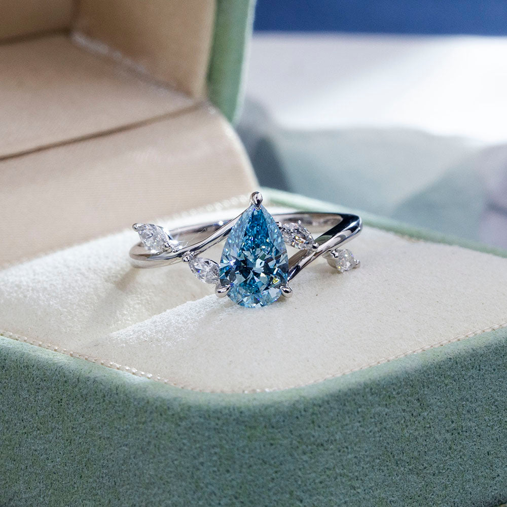 Eco-1860: Skyborn Grace – Lab-Grown Blue Diamond Leaf Ring in 18K White Gold