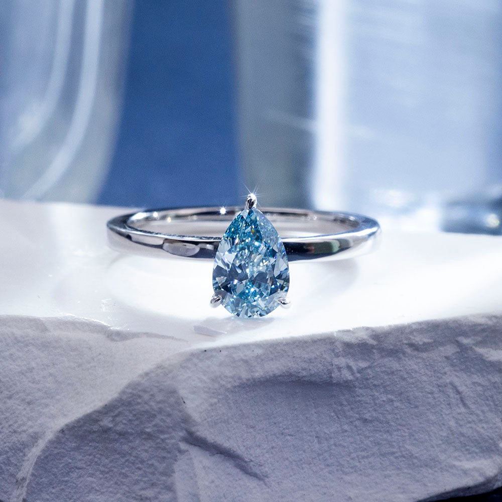 Eco-1861: Ocean Ember – Lab-Grown Blue Diamond Solitaire Ring in 18K White Gold