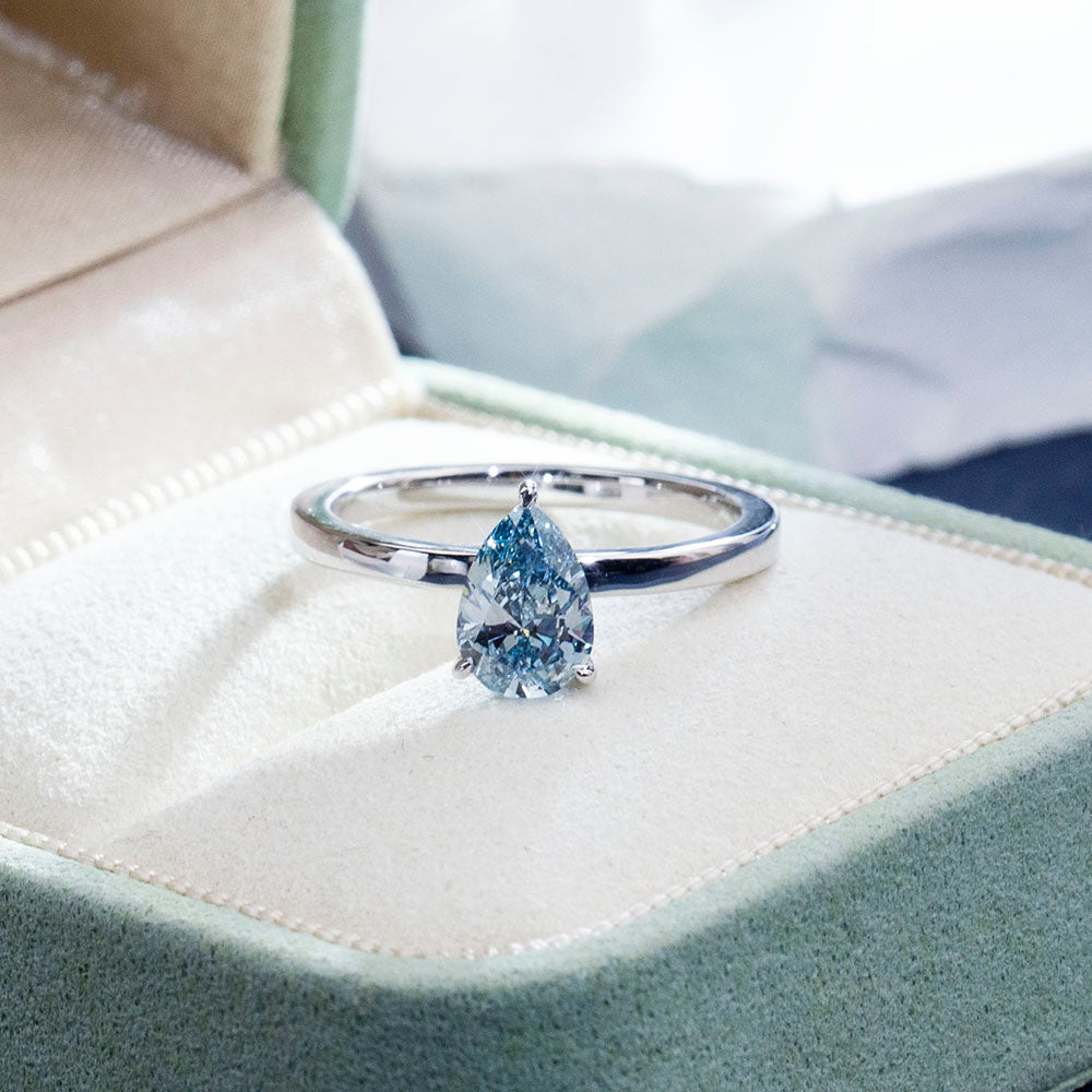 Eco-1861: Ocean Ember – Lab-Grown Blue Diamond Solitaire Ring in 18K White Gold