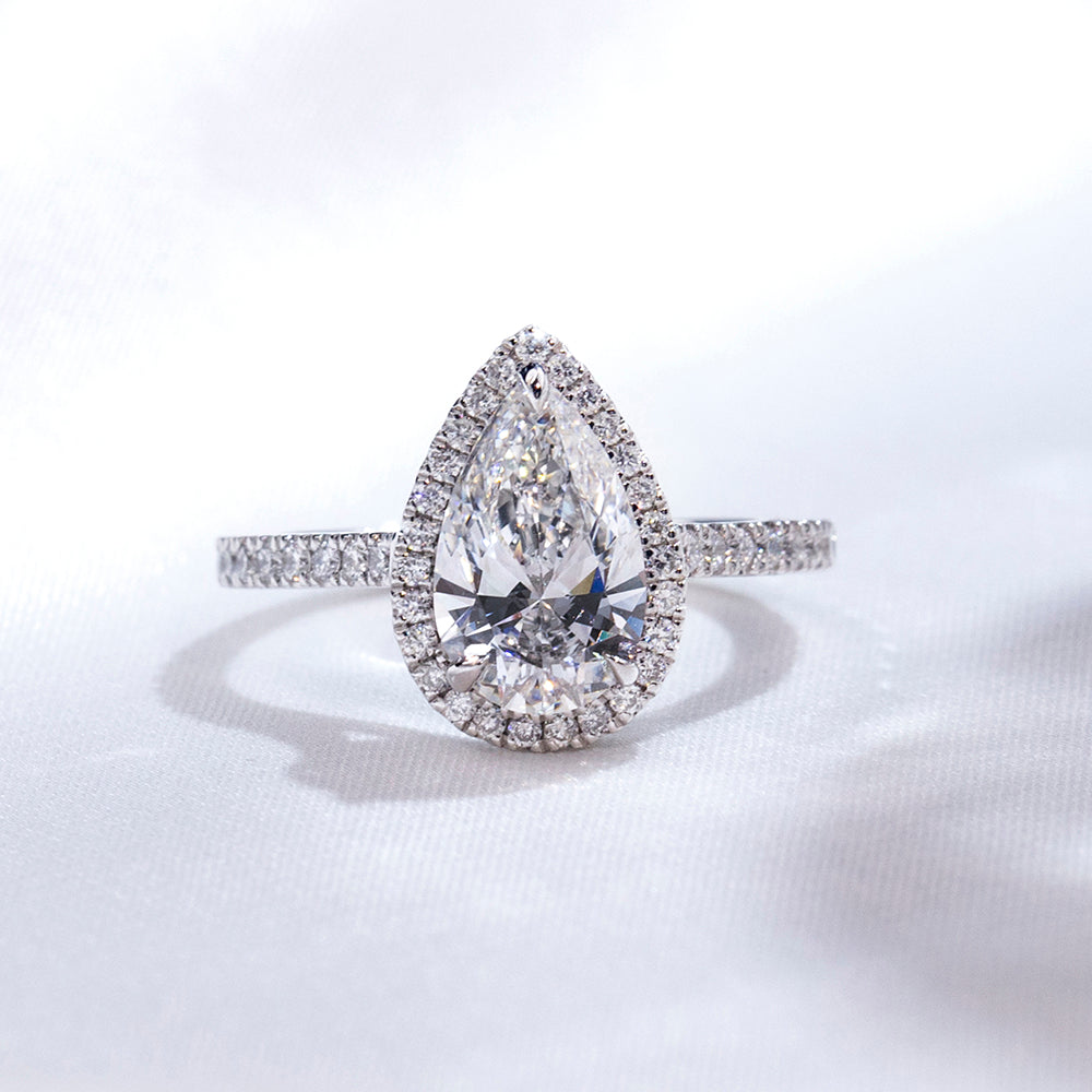Eco-1884: Teardrop Radiance – Lab-Grown Pear Diamond Halo Ring in 18K White Gold