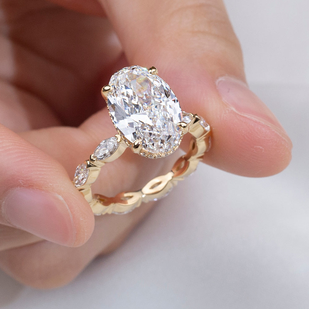 Eco-1904: Crowned Grace – Lab-Grown Oval Diamond Halo Ring with Marquise Band in 18K Yellow Gold