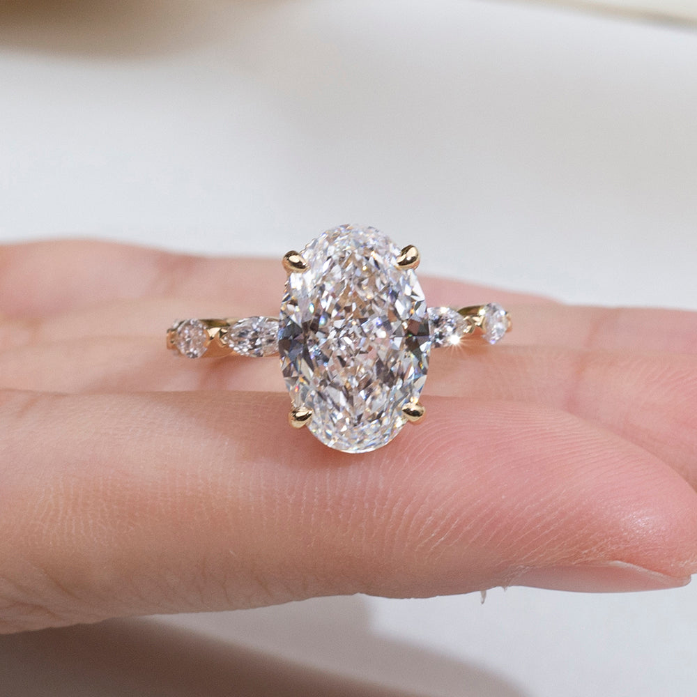 Eco-1904: Crowned Grace – Lab-Grown Oval Diamond Halo Ring with Marquise Band in 18K Yellow Gold