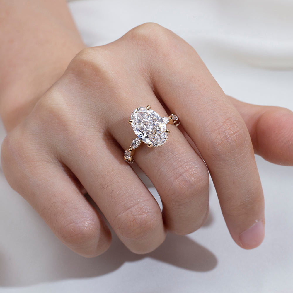 Eco-1904: Crowned Grace – Lab-Grown Oval Diamond Halo Ring with Marquise Band in 18K Yellow Gold