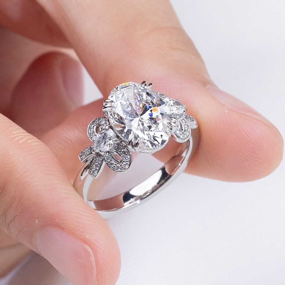 Eco-1906: Ribbon Radiance – Lab-Grown Oval Diamond Bow-Inspired Ring in 18K White Gold