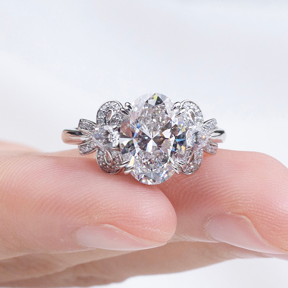 Eco-1906: Ribbon Radiance – Lab-Grown Oval Diamond Bow-Inspired Ring in 18K White Gold