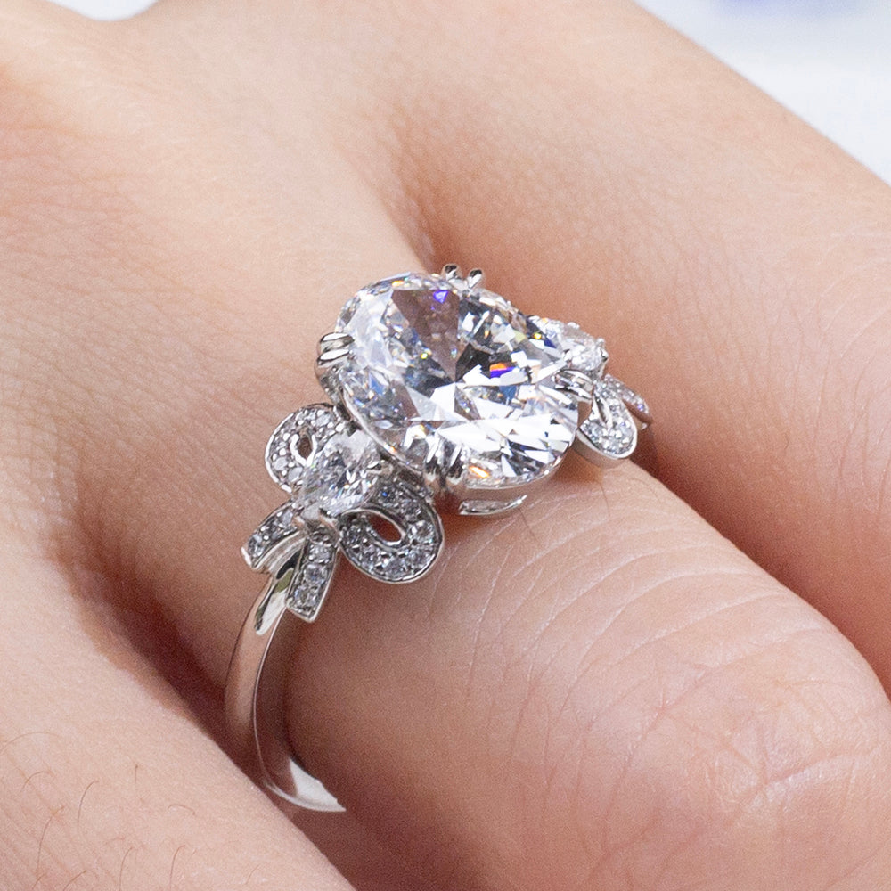 Eco-1906: Ribbon Radiance – Lab-Grown Oval Diamond Bow-Inspired Ring in 18K White Gold