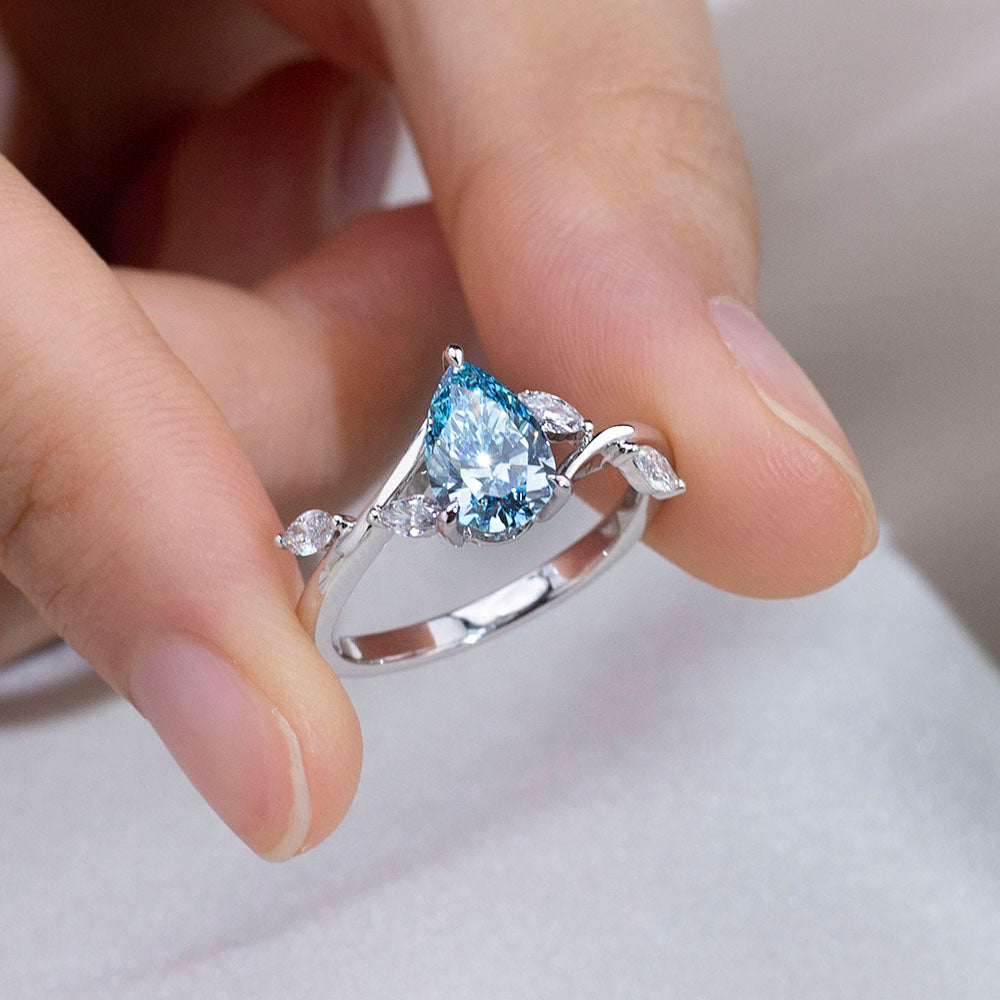 Eco-1860: Skyborn Grace – Lab-Grown Blue Diamond Leaf Ring in 18K White Gold