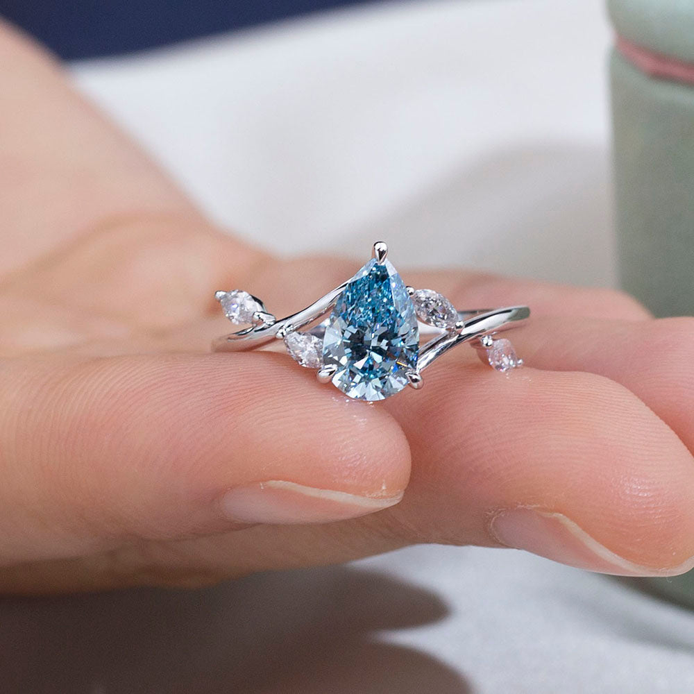 Eco-1860: Skyborn Grace – Lab-Grown Blue Diamond Leaf Ring in 18K White Gold