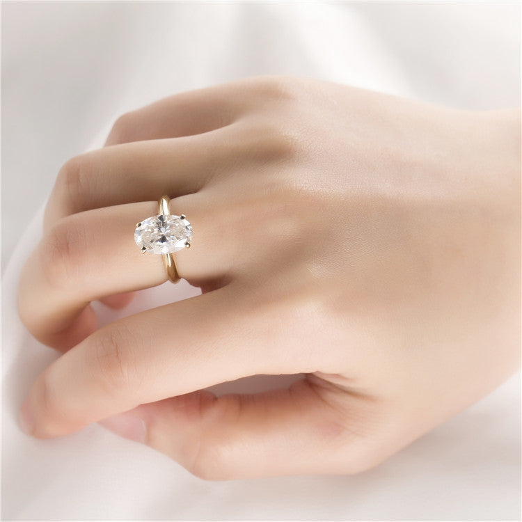 Eco-392: Elipse dorada – Anillo solitario con diamante ovalado cultivado en laboratorio en oro amarillo de 18 quilates 